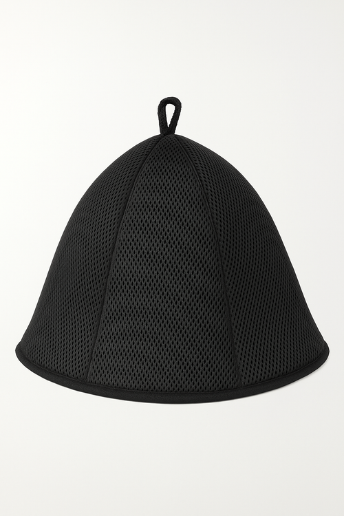 Black double mesh sauna hat on display in a wooden sauna with warm ambient lighting